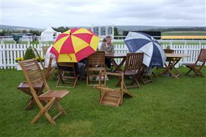 CHICHESTER, ENGLAND - JULY 30: Strong winds and drizzle during the Qatar Goodwood Festival at Goodwood Racecourse on July 30, 2021 in Chichester, England. (Photo by Alan Crowhurst/Getty Images)