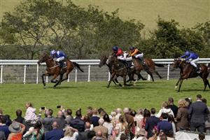 CHICHESTER, ENGLAND - JULY 30: Jim Crowley riding Maydanny (L) win The Unibet Golden Mile Handicap during the Qatar Goodwood Festival at Goodwood Racecourse on July 30, 2021 in Chichester, England. (Photo by Alan Crowhurst/Getty Images)