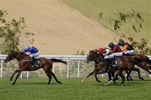 CHICHESTER, ENGLAND - JULY 30: Jim Crowley riding Maydanny (L) win The Unibet Golden Mile Handicap during the Qatar Goodwood Festival at Goodwood Racecourse on July 30, 2021 in Chichester, England. (Photo by Alan Crowhurst/Getty Images)
