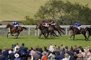 CHICHESTER, ENGLAND - JULY 30: Jim Crowley riding Maydanny (L) win The Unibet Golden Mile Handicap during the Qatar Goodwood Festival at Goodwood Racecourse on July 30, 2021 in Chichester, England. (Photo by Alan Crowhurst/Getty Images)