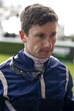 CHICHESTER, ENGLAND - JULY 30: Oisin Murphy returns to the weighing room during the Qatar Goodwood Festival at Goodwood Racecourse on July 30, 2021 in Chichester, England. (Photo by Alan Crowhurst/Getty Images)
