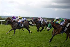 CHICHESTER, ENGLAND - JULY 31: Connor Beasley riding Commanche Falls (L, yellow/black) win The Unibet Stewards' Cup during the Qatar Goodwood Festival at Goodwood Racecourse on July 31, 2021 in Chichester, England. (Photo by Alan Crowhurst/Getty Images)