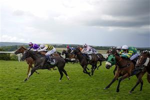 CHICHESTER, ENGLAND - JULY 31: Connor Beasley riding Commanche Falls (L, yellow/black) win The Unibet Stewards' Cup during the Qatar Goodwood Festival at Goodwood Racecourse on July 31, 2021 in Chichester, England. (Photo by Alan Crowhurst/Getty Images)