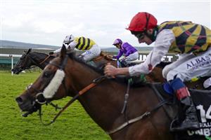 CHICHESTER, ENGLAND - JULY 31: Connor Beasley riding Commanche Falls (L, yellow/black) win The Unibet Stewards' Cup during the Qatar Goodwood Festival at Goodwood Racecourse on July 31, 2021 in Chichester, England. (Photo by Alan Crowhurst/Getty Images)