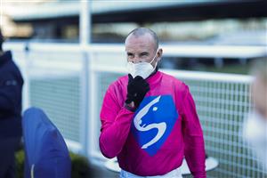SYDNEY, AUSTRALIA - AUGUST 07: Glen Boss pulls at his mask after winning race 5 the Midway Handicap during Sydney Racing at Royal Randwick Racecourse on August 07, 2021 in Sydney, Australia. (Photo by Mark Evans/Getty Images)