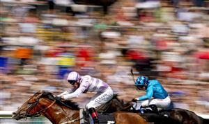 NEWBURY, ENGLAND - AUGUST 14: Adam Kirby riding Aratus (L) win The BetVictor Handicap at Newbury Racecourse on August 14, 2021 in Newbury, England. (Photo by Alan Crowhurst/Getty Images)