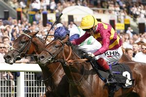 NEWBURY, ENGLAND - AUGUST 14: William Buick riding Masekela (farside) win The Academy Insurance British EBF Maiden Stakes from David Egan and Bayside Boy (nearest) at Newbury Racecourse on August 14, 2021 in Newbury, England. (Photo by Alan Crowhurst/Getty Images)
