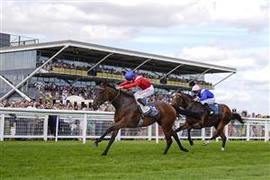 NEWBURY, ENGLAND - AUGUST 14: Tom Marquand riding Sacred (red) win The BetVictor Hungerford Stakes at Newbury Racecourse on August 14, 2021 in Newbury, England. (Photo by Alan Crowhurst/Getty Images)