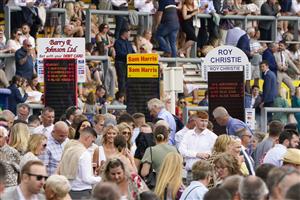 NEWBURY, ENGLAND - AUGUST 14: Busy around the bookmakers at Newbury Racecourse on August 14, 2021 in Newbury, England. (Photo by Alan Crowhurst/Getty Images)