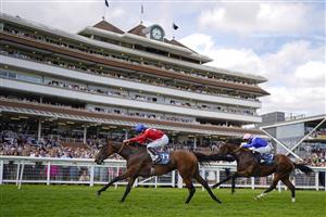NEWBURY, ENGLAND - AUGUST 14: Tom Marquand riding Sacred (red) win The BetVictor Hungerford Stakes at Newbury Racecourse on August 14, 2021 in Newbury, England. (Photo by Alan Crowhurst/Getty Images)