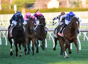 MELBOURNE, AUSTRALIA - AUGUST 14: Declan Bates riding Pintoff winning Race 9, the Evergreen Turf Regal Roller Stakes, during Melbourne Racing at Caulfield Racecourse on August 14, 2021 in Melbourne, Australia. (Photo by Vince Caligiuri/Getty Images)