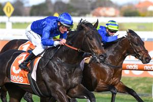 MELBOURNE, AUSTRALIA - AUGUST 14: Damien Oliver riding Ingratiating winning race 6, the Neds Vain Stakes, during Melbourne Racing at Caulfield Racecourse on August 14, 2021 in Melbourne, Australia. (Photo by Vince Caligiuri/Getty Images)