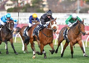 MELBOURNE, AUSTRALIA - AUGUST 14: Jamie Kah riding Gimmie Par winning Race 7, the Beck Probuild Quezette Stakes, during Melbourne Racing at Caulfield Racecourse on August 14, 2021 in Melbourne, Australia. (Photo by Vince Caligiuri/Getty Images)