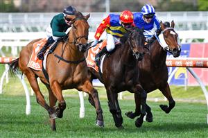 MELBOURNE, AUSTRALIA - AUGUST 14: Jamie Kah riding Second Slip winning Race 3, the Neds Filter Form Handicap, during Melbourne Racing at Caulfield Racecourse on August 14, 2021 in Melbourne, Australia. (Photo by Vince Caligiuri/Getty Images)