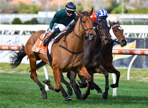 MELBOURNE, AUSTRALIA - AUGUST 14: Jamie Kah riding Second Slip winning Race 3, the Neds Filter Form Handicap, during Melbourne Racing at Caulfield Racecourse on August 14, 2021 in Melbourne, Australia. (Photo by Vince Caligiuri/Getty Images)