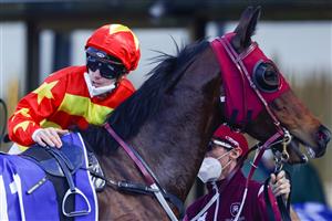 KEMBLA, AUSTRALIA - AUGUST 14: Tim Clark dismounts Prince Invincible after winning race 5 the Midway Handicap during Sydney Racing at Kembla Grange on August 14, 2021 in Kembla, Australia. (Photo by Mark Evans/Getty Images)