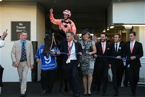 SYDNEY, AUSTRALIA - APRIL 13: Luke Nolan who rode "Black Caviar" to win race 9 the Darley TJ Smith Stakes returns to the mounting yard with the connections on Australian Derby Day at Royal Randwick Racecourse on April 13, 2013 in Sydney, Australia. (Photo by Mark Kolbe/Getty Images)