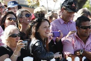 ADELAIDE, AUSTRALIA - APRIL 28: Race goers try to get a glimps of Black Caviar in the parade ring ahead of the feature race during the Schweppes Oaks Day at Morphettville Racecourse on April 28, 2012 in Adelaide, Australia. (Photo by Regi Varghese/Getty Images)