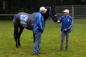 NEWMARKET, ENGLAND - JUNE 21: Black Caviar with trainier Peter Moody (L) at Newmarket Racecourse on June 21, 2012 in Newmarket, England. (Photo by Dean Mouhtaropoulos/Getty Images)