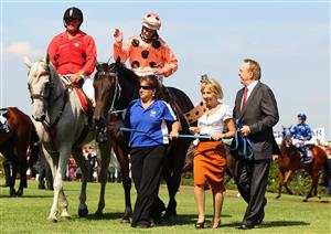 MELBOURNE, AUSTRALIA - FEBRUARY 18: Jockey Luke Nolen riding Black Caviar salutes the crowd as he returns to scale after winning Race Six the Coolmore Lightning Stakes during Lightning Stakes Day at Flemington Racecourse on February 18, 2012 in Melbourne, Australia. (Photo by Mark Dadswell/Getty Images)
