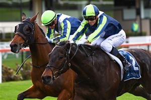 MELBOURNE, AUSTRALIA - AUGUST 21: Ethan Brown riding Floating Artist defeats Luke Currie riding Coolth in Race 4, the Tony Gulliver Handicap, during Melbourne Racing at Moonee Valley Racecourse on August 21, 2021 in Melbourne, Australia. (Photo by Vince Caligiuri/Getty Images)