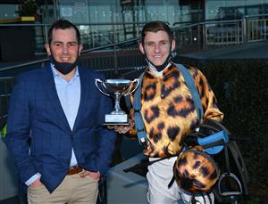 MELBOURNE, AUSTRALIA - AUGUST 28: Beau Mertens poses with trainer Gavin Bedggood after riding No Effort to win Race 7, the Tile Importer Heatherlie Stakes, during Melbourne Racing at Caulfield Racecourse on August 28, 2021 in Melbourne, Australia. (Photo by Vince Caligiuri/Getty Images)