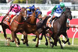 MELBOURNE, AUSTRALIA - AUGUST 28: Jye McNeil riding Tooradin winning Race 1, the Neds Handicap, during Melbourne Racing at Caulfield Racecourse on August 28, 2021 in Melbourne, Australia. (Photo by Vince Caligiuri/Getty Images)