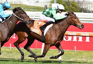 MELBOURNE, AUSTRALIA - AUGUST 28: Jye McNeil riding Turaath winning Race 3, the Evergreen Turf Handicap, during Melbourne Racing at Caulfield Racecourse on August 28, 2021 in Melbourne, Australia. (Photo by Vince Caligiuri/Getty Images)