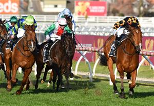 MELBOURNE, AUSTRALIA - AUGUST 28: Brett Prebble riding Behemoth defeats Linda Meech riding Beau Rossa (L) in Race 8, the Moet & Chandon Memsie Stakes, during Melbourne Racing at Caulfield Racecourse on August 28, 2021 in Melbourne, Australia. (Photo by Vince Caligiuri/Getty Images)