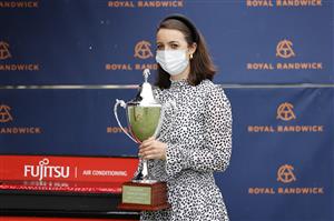 SYDNEY, AUSTRALIA - SEPTEMBER 04: Annabel Neasham poses with the trophy after winning wins race 7 the Fujitsu General Tramway Stakes with Zaaki during Sydney Racing at Royal Randwick Racecourse on September 04, 2021 in Sydney, Australia. (Photo by Mark Evans/Getty Images)