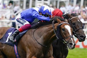 DONCASTER, ENGLAND - SEPTEMBER 09: Frankie Dettori riding Harrovian (blue) win The Hilton Garden Inn Doncaster Conditions Stakes from Ryan Moore and Sinjaari (red) at Doncaster Racecourse on September 09, 2021 in Doncaster, England. (Photo by Alan Crowhurst/Getty Images)