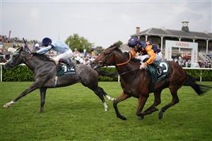 DONCASTER, ENGLAND - SEPTEMBER 09: Oisin Murphy riding Harrow (L) win The Weatherbys Scientific 200,000 2-Y-O Stakes from Daniel Tudhope and Ever Green at Doncaster Racecourse on September 09, 2021 in Doncaster, England. (Photo by Alan Crowhurst/Getty Images)