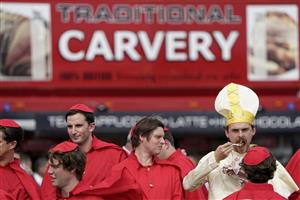DONCASTER, ENGLAND - SEPTEMBER 10: A group of lads enjoy the day dressed as Cardinal's at Doncaster Racecourse on September 10, 2021 in Doncaster, England. (Photo by Alan Crowhurst/Getty Images)