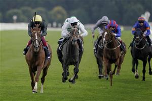DONCASTER, ENGLAND - SEPTEMBER 10: Frankie Dettori riding Stradivarius (L, yellow cap) win The Doncaster Cup Stakes at Doncaster Racecourse on September 10, 2021 in Doncaster, England. (Photo by Alan Crowhurst/Getty Images)