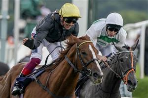 DONCASTER, ENGLAND - SEPTEMBER 10: Frankie Dettori riding Stradivarius (L, yellow cap) win The Doncaster Cup Stakes at Doncaster Racecourse on September 10, 2021 in Doncaster, England. (Photo by Alan Crowhurst/Getty Images)