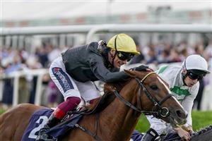 DONCASTER, ENGLAND - SEPTEMBER 10: Frankie Dettori riding Stradivarius (L, yellow cap) win The Doncaster Cup Stakes at Doncaster Racecourse on September 10, 2021 in Doncaster, England. (Photo by Alan Crowhurst/Getty Images)