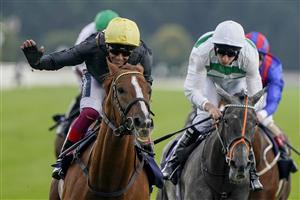 DONCASTER, ENGLAND - SEPTEMBER 10: Frankie Dettori riding Stradivarius (L, yellow cap) win The Doncaster Cup Stakes at Doncaster Racecourse on September 10, 2021 in Doncaster, England. (Photo by Alan Crowhurst/Getty Images)