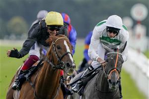 DONCASTER, ENGLAND - SEPTEMBER 10: Frankie Dettori riding Stradivarius (L, yellow cap) win The Doncaster Cup Stakes at Doncaster Racecourse on September 10, 2021 in Doncaster, England. (Photo by Alan Crowhurst/Getty Images)