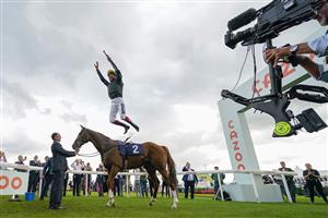 DONCASTER, ENGLAND - SEPTEMBER 10: Frankie Dettori leaps from his mount in the winners enclosure after riding Stradivarius to win The Doncaster Cup Stakes at Doncaster Racecourse on September 10, 2021 in Doncaster, England. (Photo by Alan Crowhurst/Getty Images)
