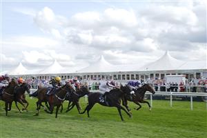 DONCASTER, ENGLAND - SEPTEMBER 11: Tom Marquand riding Hurricane Ivor (R, purple) win The Portland Handicap at Doncaster Racecourse on September 11, 2021 in Doncaster, England. (Photo by Alan Crowhurst/Getty Images)