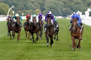 DONCASTER, ENGLAND - SEPTEMBER 11: William Buick riding Hurricane Lane (R, blue) win The Cazoo St Leger Stakes at Doncaster Racecourse on September 11, 2021 in Doncaster, England. (Photo by Alan Crowhurst/Getty Images)