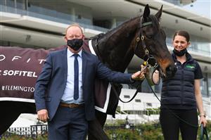 MELBOURNE, AUSTRALIA - SEPTEMBER 11: Trainer Matthew Williams poses with Harbour Views after winning in race 5, The Sofitel, during Melbourne Racing at Flemington Racecourse on September 11, 2021 in Melbourne, Australia. (Photo by Vince Caligiuri/Getty Images)