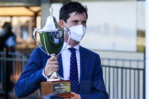 KEMBLA GRANGE, AUSTRALIA - SEPTEMBER 11: James Cummings hold up his trophy after winning race 8 the XXXX Run To The Rose on Anamoe during Sydney Racing at Kembla Grange Racecourse on September 11, 2021 in Kembla Grange, Australia. (Photo by Mark Evans/Getty Images)