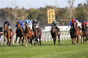 KEMBLA GRANGE, AUSTRALIA - SEPTEMBER 11: Brock Ryan (red cap) on Chat wins race 7 The Chandon Theo Marks Stakes during Sydney Racing at Kembla Grange Racecourse on September 11, 2021 in Kembla Grange, Australia. (Photo by Mark Evans/Getty Images)