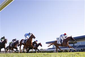 KEMBLA GRANGE, AUSTRALIA - SEPTEMBER 11: Brock Ryan (red cap) on Chat wins race 7 The Chandon Theo Marks Stakes during Sydney Racing at Kembla Grange Racecourse on September 11, 2021 in Kembla Grange, Australia. (Photo by Mark Evans/Getty Images)