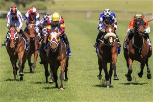 KEMBLA GRANGE, AUSTRALIA - SEPTEMBER 11: James McDonald (yellow cap) on Accountability wins race 2 the Dyson Handicap during Sydney Racing at Kembla Grange Racecourse on September 11, 2021 in Kembla Grange, Australia. (Photo by Mark Evans/Getty Images)