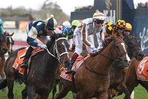 MELBOURNE, AUSTRALIA - SEPTEMBER 18: Daniel Moor riding Sierra Sue defeats Fred Kersley riding Dice Roll in Race 8, the Neds Sir Rupert Clarke Stakes, during Melbourne Racing at Caulfield Racecourse on September 18, 2021 in Melbourne, Australia. (Photo by Vince Caligiuri/Getty Images)