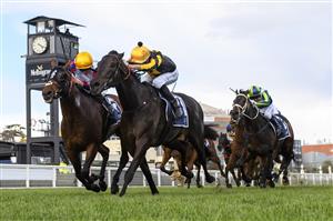 MELBOURNE, AUSTRALIA - SEPTEMBER 18: Jordan Childs riding Nonconformist defeats John Allen riding Delphi (L) in Race 7, the Catanach's Jewellers MRC Foundation Cup during Melbourne Racing at Caulfield Racecourse on September 18, 2021 in Melbourne, Australia. (Getty)