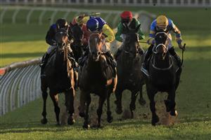 SYDNEY, AUSTRALIA - SEPTEMBER 18: Tim Clark on Triple Ace (blue cap), wins race 10 the Heineken Handicap during Sydney Racing at Royal Randwick Racecourse on September 18, 2021 in Sydney, Australia. (Photo by Mark Evans/Getty Images)