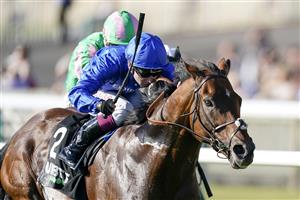 NEWMARKET, ENGLAND - SEPTEMBER 24: Oisin Murphy riding Benbatl (L, blue) win The Unibet 'You're On' Joel Stakes at Newmarket Racecourse on September 24, 2021 in Newmarket, England. (Photo by Alan Crowhurst/Getty Images)